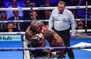 28 July 2018; Dereck Chisora knocks Carlos Takam to the canvas during their Heavyweight contest at The O2 Arena in London, England. Photo by Stephen McCarthy/Sportsfile