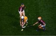 28 July 2018; Kayla Carey Weir of Raharney National School, Westmeath, representing Clare, in action against Maria Bolger of Tisrara National School, Roscommon, and Aimie Nolan of Drumphea National School, Carlow, representing Galway, during the INTO Cumann na mBunscol GAA Respect Exhibition Go Games at the GAA Hurling All-Ireland Senior Championship semi-final match between Galway and Clare at Croke Park in Dublin. Photo by Ramsey Cardy/Sportsfile