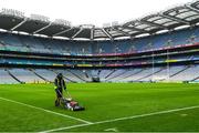 29 July 2018; A groundsman works on the pitch ahead of the GAA Hurling All-Ireland Senior Championship semi-final match between Cork and Limerick at Croke Park in Dublin. Photo by Ramsey Cardy/Sportsfile