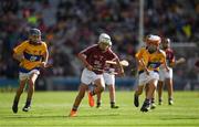 28 July 2018; Orin Burke, St Plunkett N.S., Athenry, Galway,  in action against Seán McElligot, Scoil Treasa, Cill Floinn, Co Charraí, representing Clare, and Tom Fox, St malachy's PS, Chapel Lane, Armagh, representing Clare, during the INTO Cumann na mBunscol GAA Respect Exhibition Go Games at the GAA Hurling All-Ireland Senior Championship semi-final match between Galway and Clare at Croke Park in Dublin. Photo by Ray McManus/Sportsfile