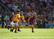 28 July 2018; Tomás Guiney, Rathnure National School, Wexford, representing Galway, in action against Jamie Moylan, St John's national School, Cratloe, Clare, representing Clare, and Paul O'Neill, Ballybrown National School, Limerick, representing Clare, during the INTO Cumann na mBunscol GAA Respect Exhibition Go Games at the GAA Hurling All-Ireland Senior Championship semi-final match between Galway and Clare at Croke Park in Dublin. Photo by Ray McManus/Sportsfile