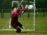29 July 2018; Rian Hogan of Crumlin United saves a penalty during the penalty shoot-out in the final against St Kevin's during Ireland's premier underaged soccer tournament, the Volkswagen Junior Masters. The competition sees U13 teams from around Ireland compete for the title and a €2,500 prize for their club, over the days of July 28th and 29th, at AUL Complex in Dublin. Photo by Seb Daly/Sportsfile