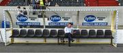 29 July 2018; Dundalk manager Stephen Kenny sitting on the home bench before the teams come out for the warm up before the SSE Airtricity League Premier Division match between Dundalk and Bohemians at Oriel Park in Dundalk, Co Louth. Photo by Oliver McVeigh/Sportsfile