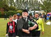 29 July 2018; Piper Chris O'Brien leads the teams out prior to the final between Crumlin United and St Kevin's during Ireland's premier underaged soccer tournament, the Volkswagen Junior Masters. The competition sees U13 teams from around Ireland compete for the title and a €2,500 prize for their club, over the days of July 28th and 29th, at AUL Complex in Dublin. Photo by Seb Daly/Sportsfile