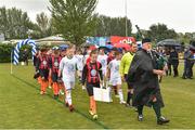 29 July 2018; Piper Chris O'Brien leads the teams out prior to the final between Crumlin United and St Kevin's during Ireland's premier underaged soccer tournament, the Volkswagen Junior Masters. The competition sees U13 teams from around Ireland compete for the title and a €2,500 prize for their club, over the days of July 28th and 29th, at AUL Complex in Dublin. Photo by Seb Daly/Sportsfile
