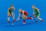29 July 2018; Zoe Wilson and Nicola Daly of Ireland vie for possession with Hannah Martin of England during the Women's Hockey World Cup Finals Group B match between England and Ireland at Lee Valley Hockey Centre, QE Olympic Park in London, England. Photo by Craig Mercer/Sportsfile