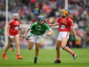 29 July 2018; Ciara Whelan-Barrett, Scoil Mhuire, Dungarvan, Co. Waterford, representing Limerick, in action against Holly Wall, Newtown Dunleckney, Carlow, representing Cork, during the INTO Cumann na mBunscol GAA Respect Exhibition Go Games at the GAA Hurling All-Ireland Senior Championship semi-final match between Cork and Limerick at Croke Park in Dublin. Photo by Ray McManus/Sportsfile