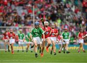 29 July 2018; Ciara Whelan-Barrett, Scoil Mhuire, Dungarvan, Co. Waterford, representing Limerick, in action against Holly Wall, Newtown Dunleckney, Carlow, representing Cork, during the INTO Cumann na mBunscol GAA Respect Exhibition Go Games at the GAA Hurling All-Ireland Senior Championship semi-final match between Cork and Limerick at Croke Park in Dublin. Photo by Ray McManus/Sportsfile