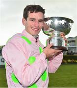 31 July 2018; Jockey Danny Mullins celebrates with the trophy after winning the Colm Quinn BMW Mile Handicap on Riven Light during the Galway Races Summer Festival 2018, in Ballybrit, Galway. Photo by Seb Daly/Sportsfile