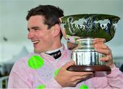 31 July 2018; Jockey Danny Mullins celebrates with the trophy after winning the Colm Quinn BMW Mile Handicap on Riven Light during the Galway Races Summer Festival 2018, in Ballybrit, Galway. Photo by Seb Daly/Sportsfile