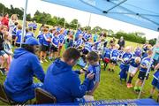 1 August 2018; Leinster players Tadhg Furlong, right, and James Lowe signing autographs during the Bank of Ireland Leinster Rugby Summer Camp at Gorey RFC in Wexford. Photo by Eóin Noonan/Sportsfile