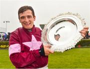 1 August 2018; Jockey Mark Enright celebrates with the trophy after winning the TheTote.com Galway Plate Handicap Steeplechase on Clarcam during the Galway Races Summer Festival 2018, in Ballybrit, Galway. Photo by Seb Daly/Sportsfile