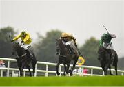 2 August 2018; Calie Du Mesnil, centre, with David Mullins up, races alongside eventual second place Sapphire Lady, left, with Danny Mullins up, and eventual third place Exchange Rate, right, with Ruby Walsh up, on their way to winning the Guinness Novice Hurdle during the Galway Races Summer Festival 2018, in Ballybrit, Galway. Photo by Seb Daly/Sportsfile