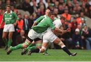 30 March 2003; England's Richard Hill is tackled by Ireland's Malcolm O'Kelly. RBS Six Nations Rugby Championship, Ireland v England, Lansdowne Road, Dublin. Photo by Brendan Moran/Sportsfile