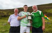 4 August 2018; Cillian Kiely of Offaly is presented with Corn Setanta, after winning the senior men's competition, by Poc Fada Chairman Tom Ryan, left, and Poc Fada sponsor Martin Donnelly, after the 2018 M Donnelly GAA All-Ireland Poc Fada Finals in the Annaverna Mountain, Ravensdale, Co Louth. Photo by Piaras Ó Mídheach/Sportsfile
