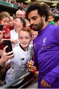 4 August 2018; Mohamed Salah of Liverpool poses for a photograph with a supporter following the Pre Season Friendly match between Liverpool and Napoli at the Aviva Stadium in Dublin. Photo by Seb Daly/Sportsfile