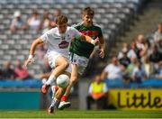 5 August 2018; Brian McLoughlin of Kildare scores his side's first goal as Brian O'Malley of Mayo closes in during the EirGrid GAA Football All-Ireland U20 Championship final match between Mayo and Kildare at Croke Park in Dublin. Photo by Piaras Ó Mídheach/Sportsfile