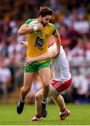 5 August 2018; Odhrán MacNiallais of Donegal in action against Frank Burns of Tyrone during the GAA Football All-Ireland Senior Championship Quarter-Final Group 2 Phase 3 match between Tyrone and Donegal at MacCumhaill Park in Ballybofey, Co Donegal. Photo by Stephen McCarthy/Sportsfile