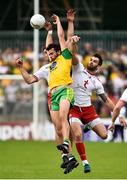 5 August 2018; Odhran MacNiallais of Donegal in action against Niall Sludden and Ronan McNamee of Tyrone during the GAA Football All-Ireland Senior Championship Quarter-Final Group 2 Phase 3 match between Tyrone and Donegal at MacCumhaill Park in Ballybofey, Co Donegal. Photo by Oliver McVeigh/Sportsfile