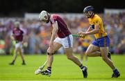 5 August 2018; Joe Canning of Galway races clear of David McInerney of Clare during the GAA Hurling All-Ireland Senior Championship semi-final replay match between Galway and Clare at Semple Stadium in Thurles, Co Tipperary. Photo by Brendan Moran/Sportsfile