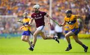 5 August 2018; Joe Canning of Galway races clear of David McInerney of Clare during the GAA Hurling All-Ireland Senior Championship semi-final replay match between Galway and Clare at Semple Stadium in Thurles, Co Tipperary. Photo by Brendan Moran/Sportsfile