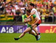 5 August 2018; Leo McLoone of Donegal in action against Mattie Donnelly of Tyrone during the GAA Football All-Ireland Senior Championship Quarter-Final Group 2 Phase 3 match between Tyrone and Donegal at MacCumhaill Park in Ballybofey, Co Donegal. Photo by Philip Fitzpatrick/Sportsfile