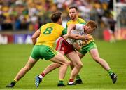 5 August 2018; Peter Harte of Tyrone in action against Hugh McFadden, left, and Eamonn Doherty of Donegal during the GAA Football All-Ireland Senior Championship Quarter-Final Group 2 Phase 3 match between Tyrone and Donegal at MacCumhaill Park in Ballybofey, Co Donegal. Photo by Oliver McVeigh/Sportsfile