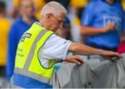 5 August 2018; Croke Park steward Tommy Tolster places the covers on the substitutes seats after the GAA Football All-Ireland Senior Championship Quarter-Final Group 2 Phase 3 match between Dublin and Roscommon at Croke Park in Dublin. Photo by Daire Brennan/Sportsfile