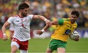 5 August 2018; Odhran MacNiallais of Donegal in action against Pádraig Hampsey of Tyrone during the GAA Football All-Ireland Senior Championship Quarter-Final Group 2 Phase 3 match between Tyrone and Donegal at MacCumhaill Park in Ballybofey, Co Donegal. Photo by Oliver McVeigh/Sportsfile