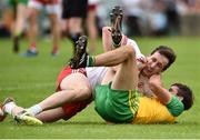 5 August 2018; Odhran MacNiallais of Donegal and Colm Cavanagh of Tyrone tussle during the GAA Football All-Ireland Senior Championship Quarter-Final Group 2 Phase 3 match between Tyrone and Donegal at MacCumhaill Park in Ballybofey, Co Donegal. Photo by Oliver McVeigh/Sportsfile