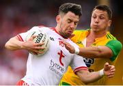 5 August 2018; Mattie Donnelly of Tyrone in action against Paul Brennan of Donegal during the GAA Football All-Ireland Senior Championship Quarter-Final Group 2 Phase 3 match between Tyrone and Donegal at MacCumhaill Park in Ballybofey, Co Donegal. Photo by Stephen McCarthy/Sportsfile