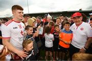 5 August 2018; Cathal McShane and Tyrone manager Mickey Harte poses for photographs with supporters following the GAA Football All-Ireland Senior Championship Quarter-Final Group 2 Phase 3 match between Tyrone and Donegal at MacCumhaill Park in Ballybofey, Co Donegal. Photo by Stephen McCarthy/Sportsfile