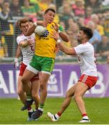 5 August 2018; Paul Brennan of Donegal in action against Peter Harte and Tiernan McCann of Tyrone  during the GAA Football All-Ireland Senior Championship Quarter-Final Group 2 Phase 3 match between Tyrone and Donegal at MacCumhaill Park in Ballybofey, Co Donegal. Photo by Oliver McVeigh/Sportsfile