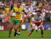 5 August 2018; Michael Murphy of Donegal in action against Richard Donnelly of Tyrone during the GAA Football All-Ireland Senior Championship Quarter-Final Group 2 Phase 3 match between Tyrone and Donegal at MacCumhaill Park in Ballybofey, Co Donegal. Photo by Philip Fitzpatrick/Sportsfile