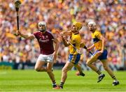 5 August 2018; Colm Galvin of Clare prepares to clear under pressure from Joe Canning of Galway during the GAA Hurling All-Ireland Senior Championship semi-final replay match between Galway and Clare at Semple Stadium in Thurles, Co Tipperary. Photo by Ray McManus/Sportsfile