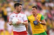 5 August 2018; Mattie Donnelly of Tyrone and Paul Brennan of Donegal during the GAA Football All-Ireland Senior Championship Quarter-Final Group 2 Phase 3 match between Tyrone and Donegal at MacCumhaill Park in Ballybofey, Co Donegal. Photo by Stephen McCarthy/Sportsfile