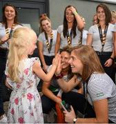 6 August 2018; Elle Shaw, age 6, from Knocklyon, Dublin meeting players from the Irish hockey team during the Irish Hockey Squad homecoming from the Women’s Hockey World Cup at Dublin Airport in Dublin. Photo by Eóin Noonan/Sportsfile
