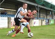 6 August 2018; Dylan Connolly of Dundalk is fouled by Kevin Taylor of Cobh Ramblers during the EA Sports Cup semi-final match between Cobh Ramblers and Dundalk at St. Colman's Park in Cobh, Co. Cork. Photo by Ben McShane/Sportsfile