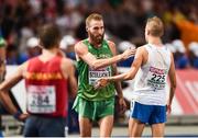 7 August 2018; Stephen Scullion of Ireland, centre, and Arttu Vattulainen of Finland shake hands after competing in the Men's 10,000m event during Day 1 of the 2018 European Athletics Championships at The Olympic Stadium in Berlin, Germany. Photo by Sam Barnes/Sportsfile