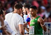 8 August 2018; Leon Reid of Ireland is interviewed by David Gillick for RTE after competing in the Men's 200m Semi-Final during Day 2 of the 2018 European Athletics Championships at The Olympic Stadium in Berlin, Germany. Photo by Sam Barnes/Sportsfile