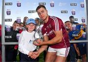 8 August 2018; Fintan Burke of Galway receives the Man of the match award from Jamie Noone, aged 10, from Killimordaly, Co. Galway, following the Bord Gais Energy GAA Hurling All-Ireland U21 Championship Semi-Final match between Galway and Tipperary at the Gaelic Grounds in Limerick. Photo by Diarmuid Greene/Sportsfile