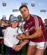 8 August 2018; Fintan Burke of Galway receives the Man of the match award from Jamie Noone, aged 10, from Killimordaly, Co. Galway, following the Bord Gais Energy GAA Hurling All-Ireland U21 Championship Semi-Final match between Galway and Tipperary at the Gaelic Grounds in Limerick. Photo by Diarmuid Greene/Sportsfile