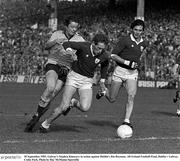 18 September 1983. Galway's Stephen Kinneavy in action against Dublin's Jim Roynane. All-Ireland Football Final, Dublin v Galway, Croke Park. Photo by Ray McManus/Sportsfile
