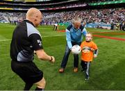 11 August 2018; GAA legend and former Dublin goalkeeper John O'Leary walks onto the pitch with his son Tom, age 7, who presented the ball to the referee Barry Cassidy, on behalf of the Jack & Jill Children's Foundation at Croke Park in Dublin. Tom, who has a very rare condition, has been supported by Jack & Jill home nursing care and John is a board member and ambassador for the charity. Photo by Ray McManus/Sportsfile