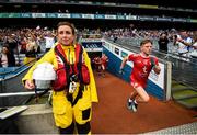 12 August 2018; Mark Bradley of Tyrone makes his way onto the pitch past RNLI volunteers prior to the GAA Football All-Ireland Senior Championship semi-final match between Monaghan and Tyrone at Croke Park in Dublin. Photo by Stephen McCarthy/Sportsfile