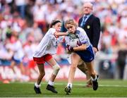 12 August 2018; Maeve Heenan, Kilbeheeny NS, Mitchelstown, Co Cork, representing Monaghan, and Mia Shannon, St Teresa's NS, Co Longford, representing Tyrone, during the INTO Cumann na mBunscol GAA Respect Exhibition Go Games at the GAA Football All-Ireland Senior Championship Semi Final match between Monaghan and Tyrone at Croke Park in Dublin.  Photo by Stephen McCarthy/Sportsfile
