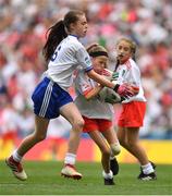 12 August 2018; Mia Shannon, St Teresa's NS, Co Longford, representing Tyrone, in action against Emma Griffin, Glinsk NS, Co Galway, representing Monaghan, during the INTO Cumann na mBunscol GAA Respect Exhibition Go Games at the GAA Football All-Ireland Senior Championship Semi Final match between Monaghan and Tyrone at Croke Park in Dublin.  Photo by Brendan Moran/Sportsfile