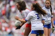 12 August 2018; Niamh Ahern, Daingean NS, Co Offaly, representing Tyrone, in action against Lauren McCann, St Aengus Bridgend, Co Donegal, representing Monaghan, during the INTO Cumann na mBunscol GAA Respect Exhibition Go Games at the GAA Football All-Ireland Senior Championship Semi Final match between Monaghan and Tyrone at Croke Park in Dublin.  Photo by Brendan Moran/Sportsfile