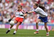12 August 2018; Katie Havern, Ballyholland PS, Newry, Co Down, representing Tyrone, in action against Emma Griffin, Glinsk NS, Co Galway, representing Monaghan, during the INTO Cumann na mBunscol GAA Respect Exhibition Go Games at the GAA Football All-Ireland Senior Championship Semi Final match between Monaghan and Tyrone at Croke Park in Dublin.  Photo by Brendan Moran/Sportsfile