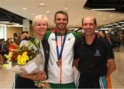 13 August 2018; Thomas Barr with his coaches Hayley and Drew Harrison at the Homecoming of the Irish Team from the European Athletics Championships in Berlin at Terminal 1 in Dublin Airport. Photo by Eóin Noonan/Sportsfile